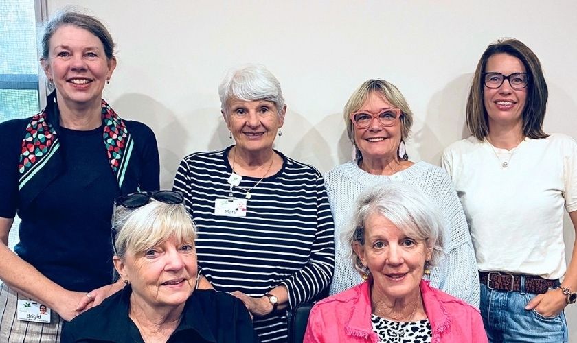a group of smiling women