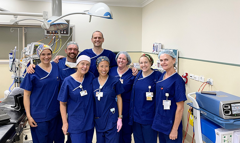 group of medical care staff standing together smiling group of medical care staff standing together smiling