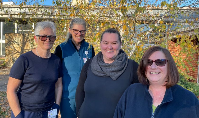 group of smiling district nurses
