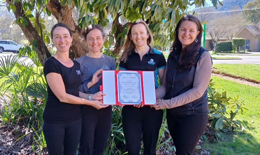 PACE team holding a certificate