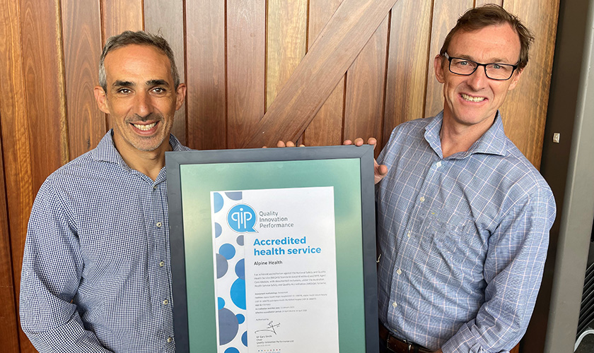CEO and Board Chair with accreditation certificate