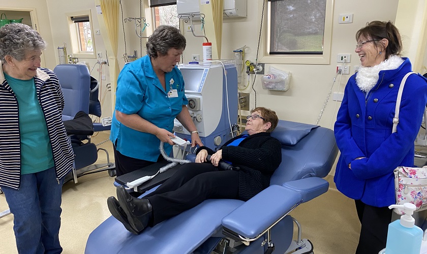 nurse with myrtleford op shop volunteers in dialysis chair